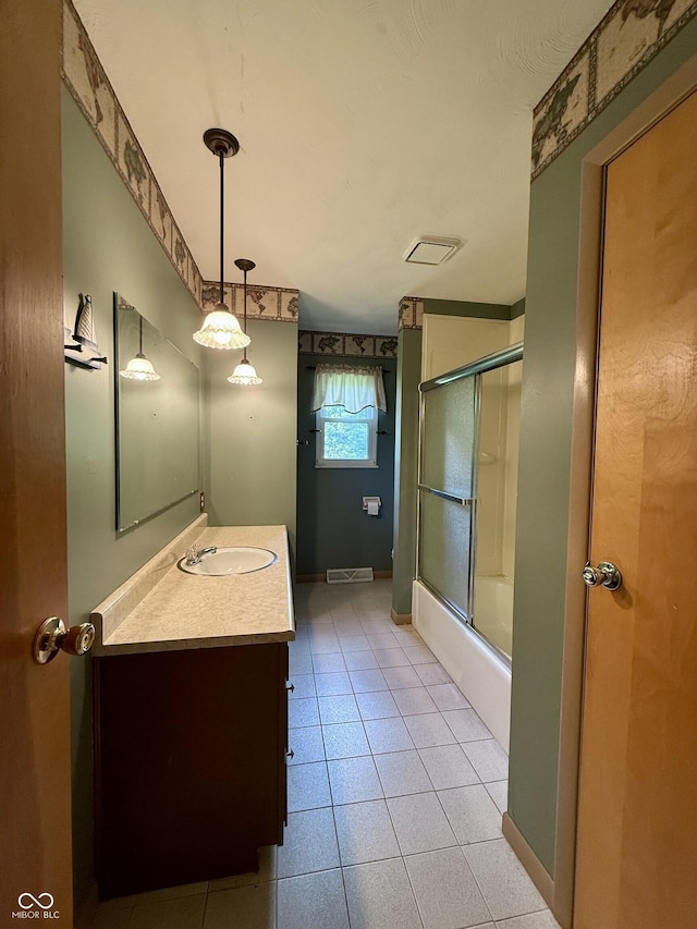 9808 E Troy Ave, Indianapolis, IN 46239 - full bath featuring vanity, enclosed tub / shower combo, and tile patterned flooring
