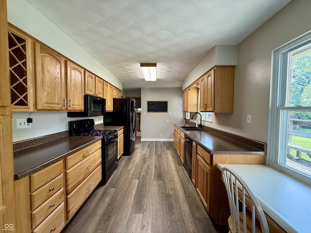 9808 E Troy Ave, Indianapolis, IN 46239 - kitchen with black appliances, dark wood-style flooring, and dark countertops