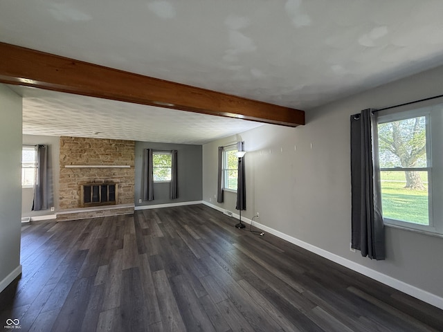 9808 E Troy Ave, Indianapolis, IN 46239 - unfurnished living room with dark wood-style floors, beam ceiling, and a fireplace