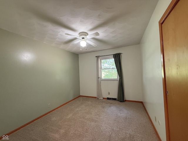 9808 E Troy Ave, Indianapolis, IN 46239 - unfurnished room with light carpet and a ceiling fan