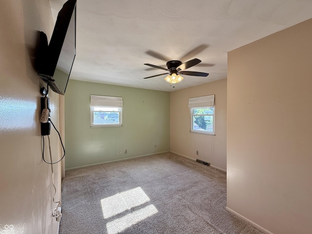 9808 E Troy Ave, Indianapolis, IN 46239 - empty room featuring ceiling fan and carpet floors