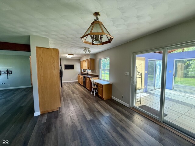 9808 E Troy Ave, Indianapolis, IN 46239 - kitchen with brown cabinets, dishwasher, and dark wood-style flooring