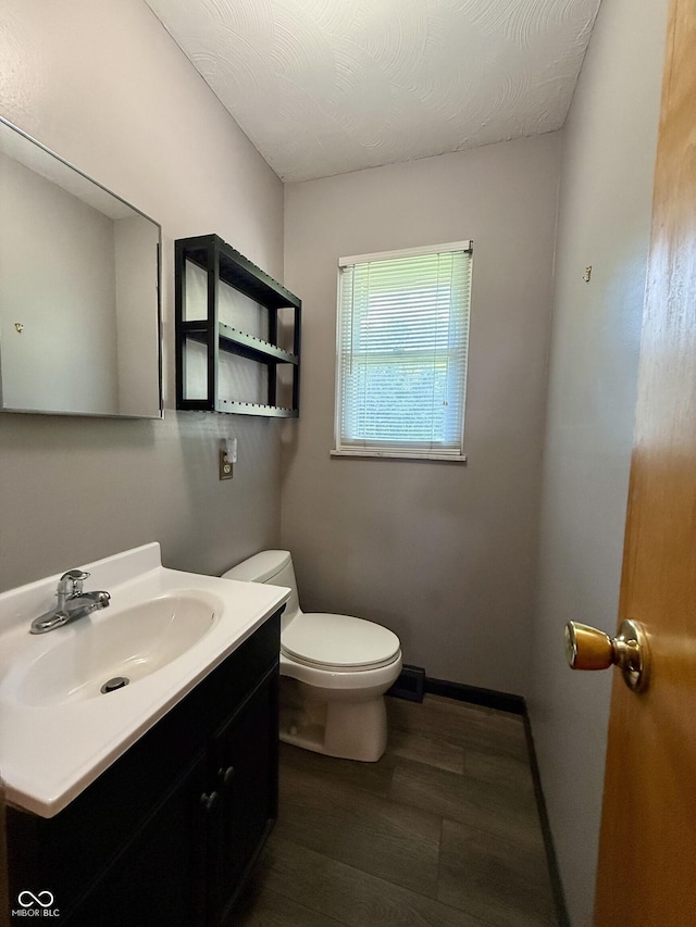 9808 E Troy Ave, Indianapolis, IN 46239 - half bathroom featuring wood finished floors and vanity