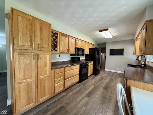 9808 E Troy Ave, Indianapolis, IN 46239 - kitchen featuring black appliances, dark countertops, and dark wood-style floors