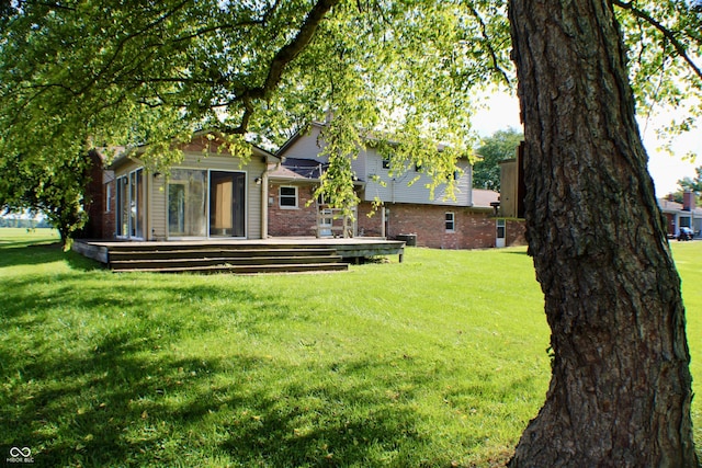 9808 E Troy Ave, Indianapolis, IN 46239 - view of grassy yard featuring a wooden deck