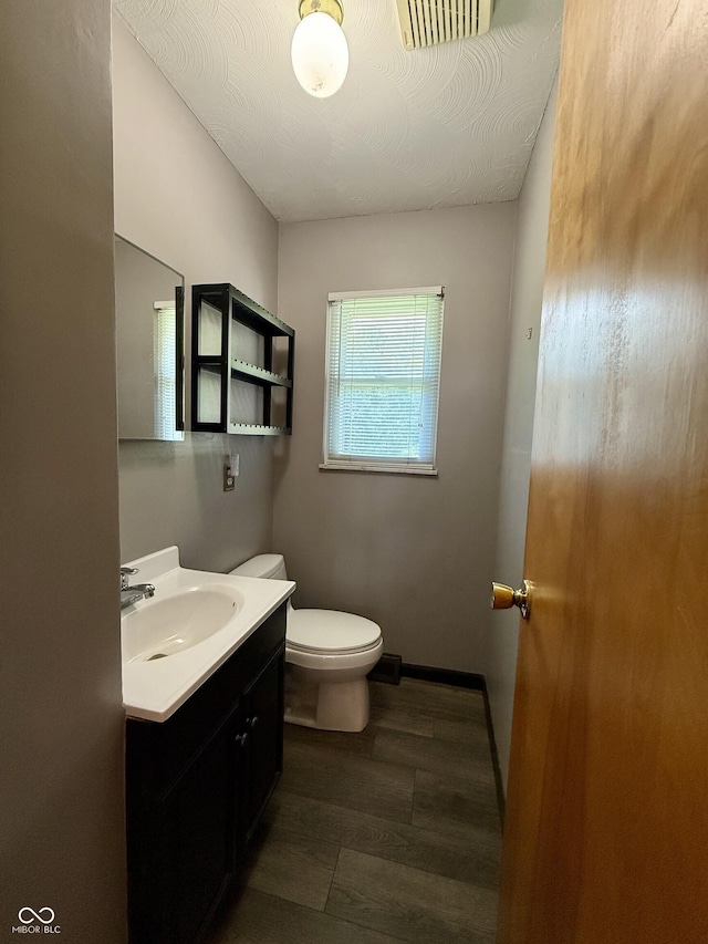 9808 E Troy Ave, Indianapolis, IN 46239 - half bathroom featuring vanity and wood finished floors