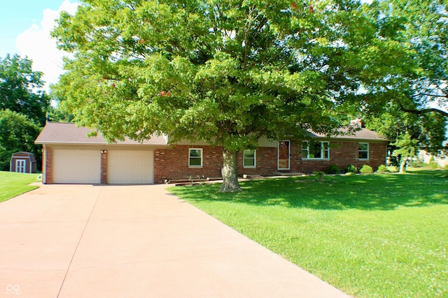 9808 E Troy Ave, Indianapolis, IN 46239 - view of front of house with brick siding, driveway, a front yard, an attached garage, and a storage unit