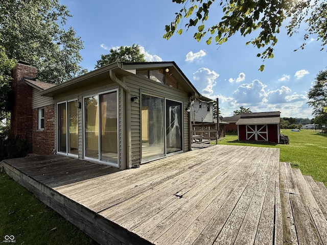 9808 E Troy Ave, Indianapolis, IN 46239 - deck featuring a storage unit and a lawn