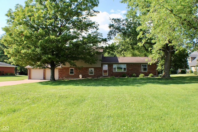 9808 E Troy Ave, Indianapolis, IN 46239 - tri-level home featuring brick siding, concrete driveway, a front lawn, and a garage