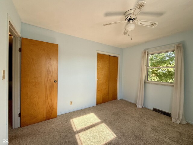 9808 E Troy Ave, Indianapolis, IN 46239 - unfurnished bedroom with carpet, ceiling fan, and a closet