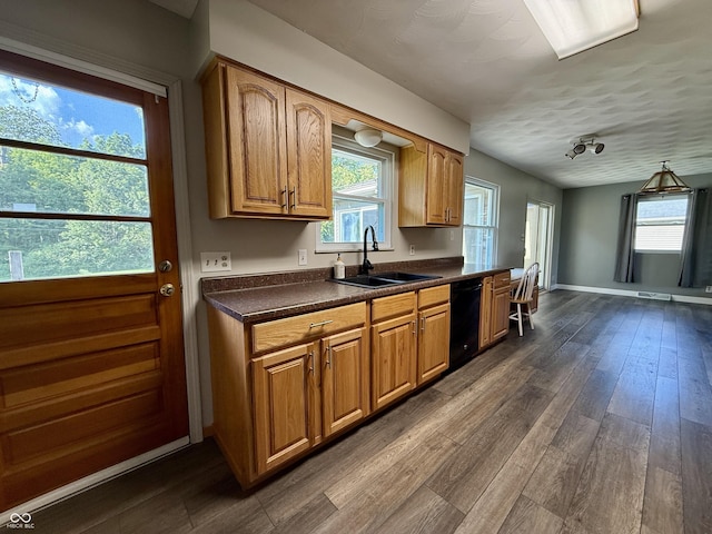 9808 E Troy Ave, Indianapolis, IN 46239 - kitchen with black dishwasher, dark countertops, dark wood-type flooring, and brown cabinetry