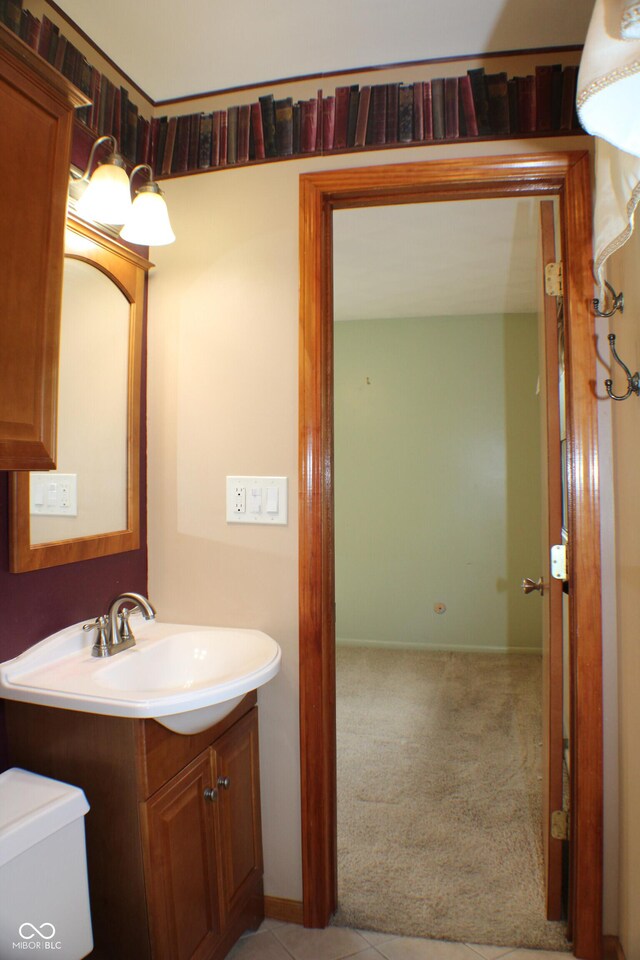 9808 E Troy Ave, Indianapolis, IN 46239 - half bathroom featuring vanity and toilet