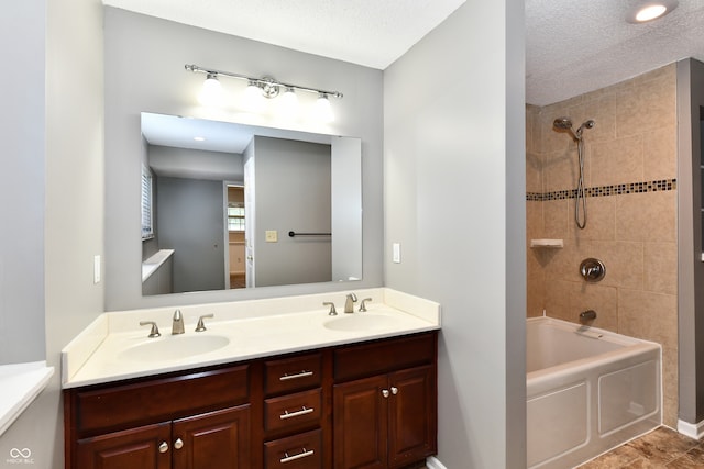 524 Concord Ct, Fishers, IN 46038 - bathroom with double vanity, shower / washtub combination, and a textured ceiling