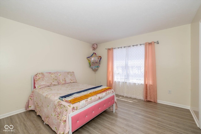 3624 Newberry Rd, Plainfield, IN 46168 - bedroom with wood finished floors and baseboards