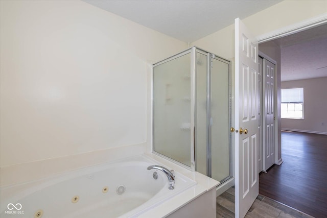 3624 Newberry Rd, Plainfield, IN 46168 - full bath with a stall shower, a tub with jets, and wood finished floors