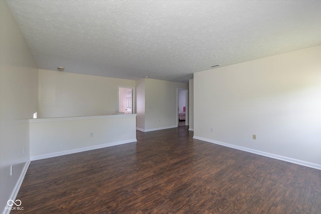 3624 Newberry Rd, Plainfield, IN 46168 - empty room featuring dark wood-type flooring and a textured ceiling