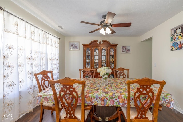 3624 Newberry Rd, Plainfield, IN 46168 - dining area with dark wood-type flooring, a ceiling fan, and a textured ceiling