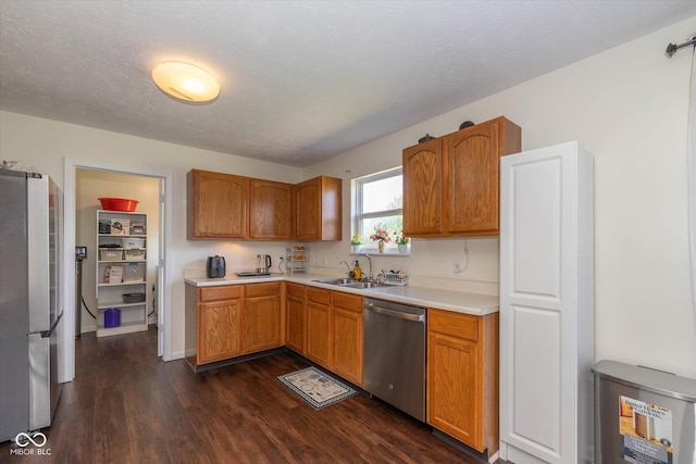 3624 Newberry Rd, Plainfield, IN 46168 - kitchen with appliances with stainless steel finishes, dark wood-type flooring, light countertops, and brown cabinets