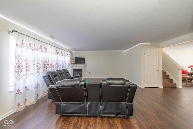 3624 Newberry Rd, Plainfield, IN 46168 - living area with stairway, dark wood finished floors, and a fireplace