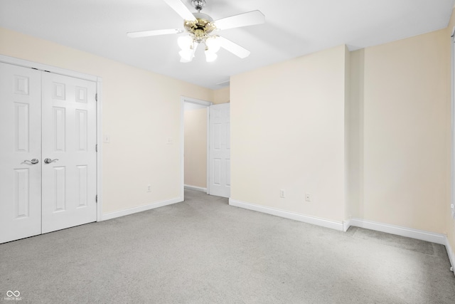 3244 Skyview Ct, Columbus, IN 47203 - unfurnished bedroom with a closet, carpet floors, and a ceiling fan