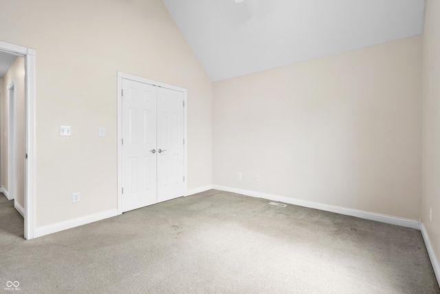 3244 Skyview Ct, Columbus, IN 47203 - unfurnished bedroom with carpet floors, a closet, and high vaulted ceiling