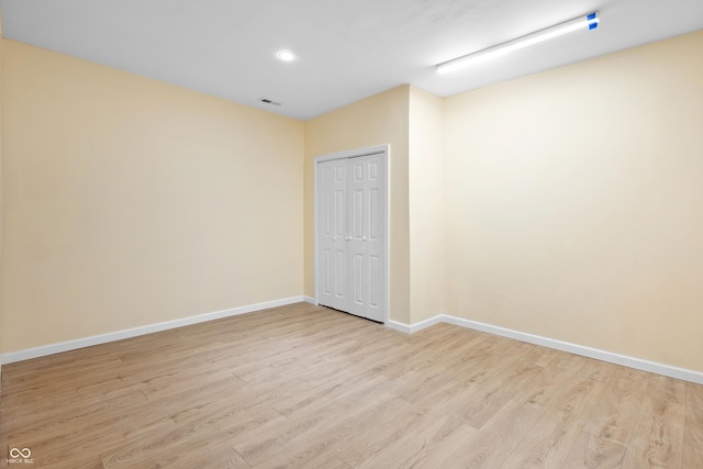 3244 Skyview Ct, Columbus, IN 47203 - unfurnished bedroom with wood finished floors, a closet, and recessed lighting
