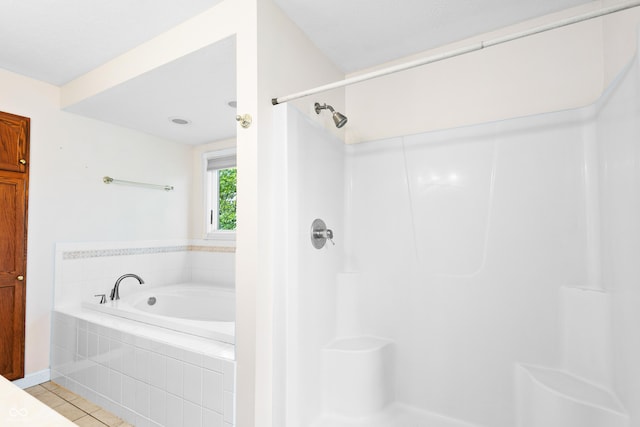 3244 Skyview Ct, Columbus, IN 47203 - bathroom featuring tile patterned floors, a garden tub, and a shower