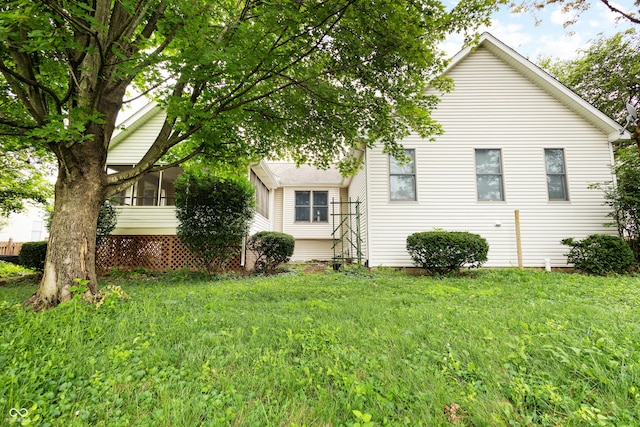 3244 Skyview Ct, Columbus, IN 47203 - view of side of home with a yard and a sunroom