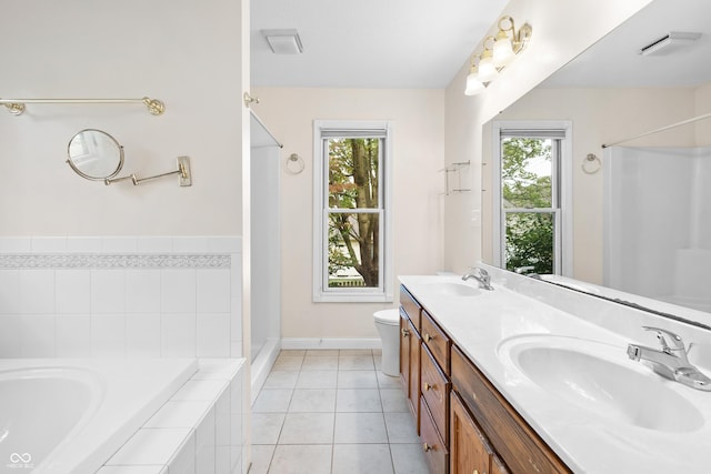 3244 Skyview Ct, Columbus, IN 47203 - full bathroom featuring a garden tub, healthy amount of natural light, double vanity, and a shower
