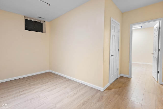 3244 Skyview Ct, Columbus, IN 47203 - empty room with light wood-style floors and baseboards