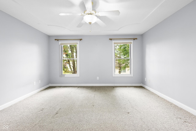 3244 Skyview Ct, Columbus, IN 47203 - empty room featuring plenty of natural light, carpet floors, and ceiling fan