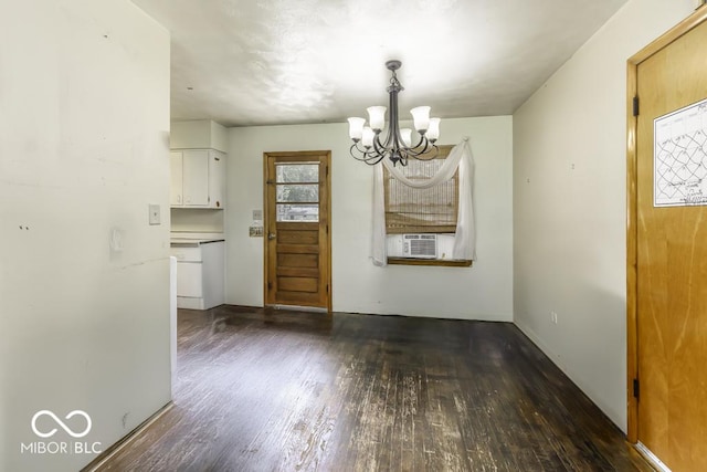 462 Woodview Dr, Noblesville, IN 46060 - unfurnished dining area featuring wood finished floors, a chandelier, and cooling unit