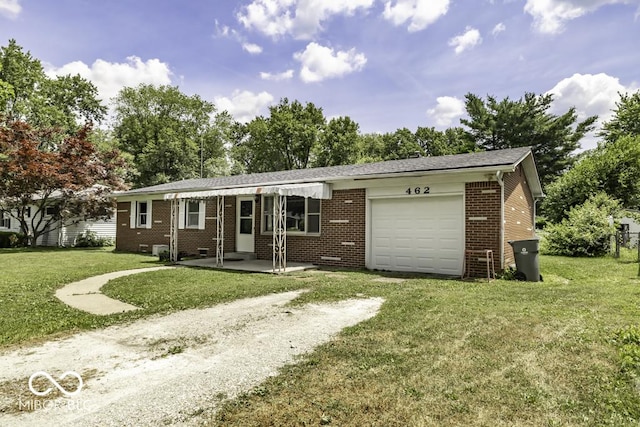 462 Woodview Dr, Noblesville, IN 46060 - single story home with dirt driveway, a garage, a front yard, and brick siding
