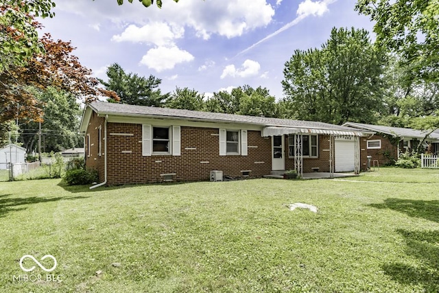 462 Woodview Dr, Noblesville, IN 46060 - back of property with an attached garage, brick siding, and crawl space