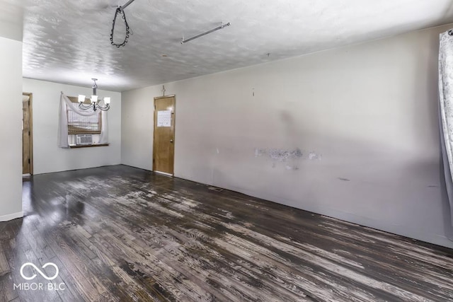 462 Woodview Dr, Noblesville, IN 46060 - empty room with wood finished floors and a chandelier