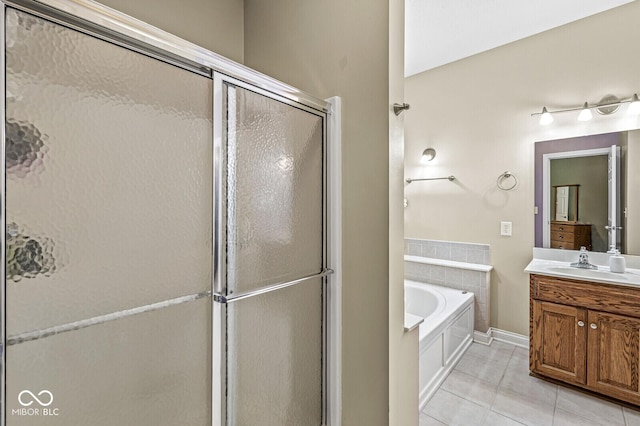 11 Stratford Way, Danville, IN 46122 - full bath with tile patterned floors, vanity, a stall shower, and a garden tub