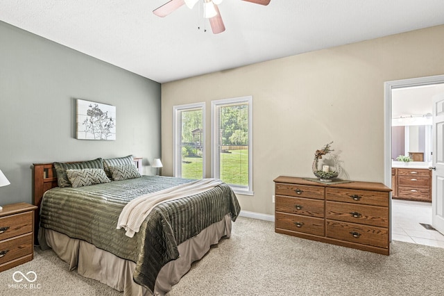 11 Stratford Way, Danville, IN 46122 - bedroom with light colored carpet, ensuite bathroom, and ceiling fan