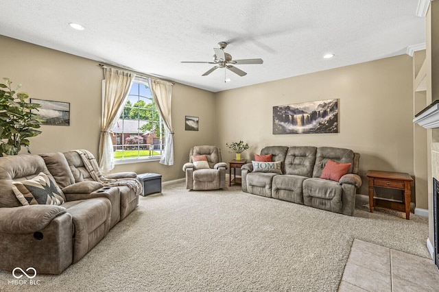 11 Stratford Way, Danville, IN 46122 - carpeted living room featuring a ceiling fan, a fireplace, a textured ceiling, and recessed lighting