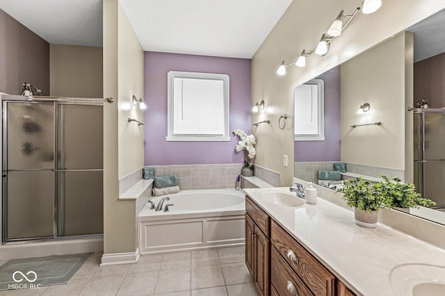 11 Stratford Way, Danville, IN 46122 - bathroom featuring tile patterned flooring, double vanity, a bath, and a stall shower