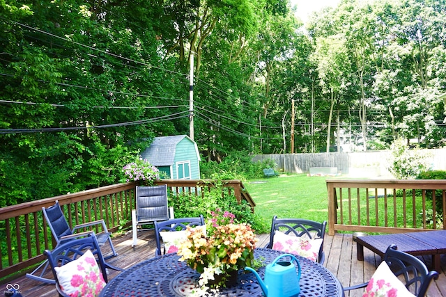 7780 Cree Trl, Indianapolis, IN 46250 - deck with outdoor dining space and a storage shed