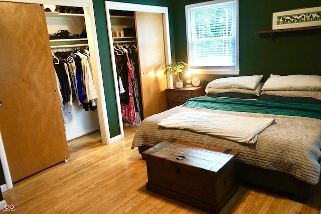 7780 Cree Trl, Indianapolis, IN 46250 - bedroom featuring two closets and wood finished floors