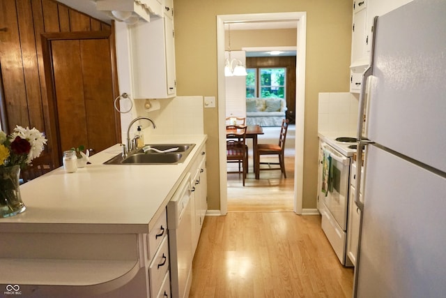 7780 Cree Trl, Indianapolis, IN 46250 - kitchen featuring white appliances, light wood-type flooring, white cabinetry, and light countertops