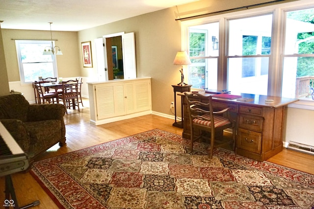 7780 Cree Trl, Indianapolis, IN 46250 - office with wood finished floors, healthy amount of natural light, and a chandelier