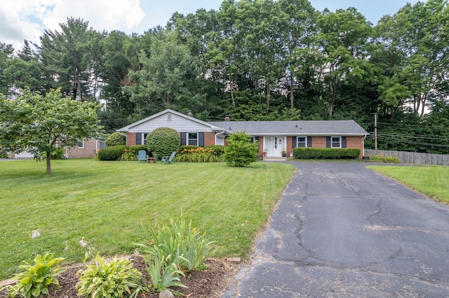 7780 Cree Trl, Indianapolis, IN 46250 - single story home with brick siding and asphalt driveway