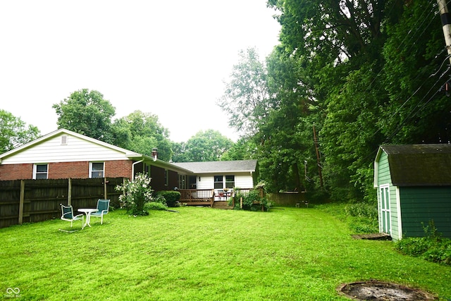 7780 Cree Trl, Indianapolis, IN 46250 - view of yard with a storage unit and a wooden deck
