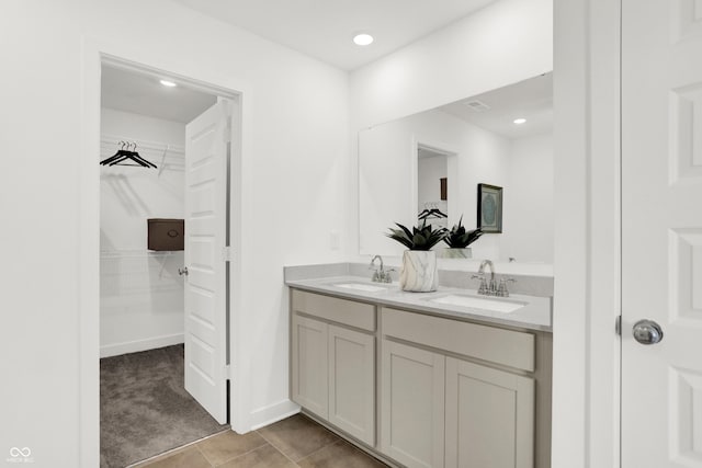 860 Hardin Pl, Greenwood, IN 46143 - full bathroom featuring double vanity, a spacious closet, and tile patterned floors