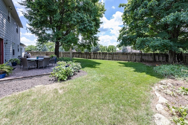 12602 Lockerbie Cir, Carmel, IN 46033 - fenced backyard featuring a patio area