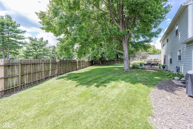 12602 Lockerbie Cir, Carmel, IN 46033 - fenced backyard with a patio area