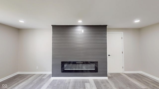 830 Stardust Blvd, Noblesville, IN 46060 - detailed view of wood finished floors, a large fireplace, and recessed lighting