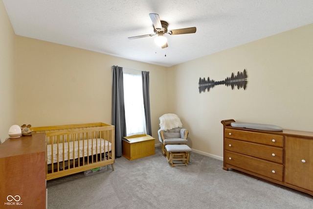 7683 Madden Dr, Fishers, IN 46038 - carpeted bedroom with a nursery area and a ceiling fan
